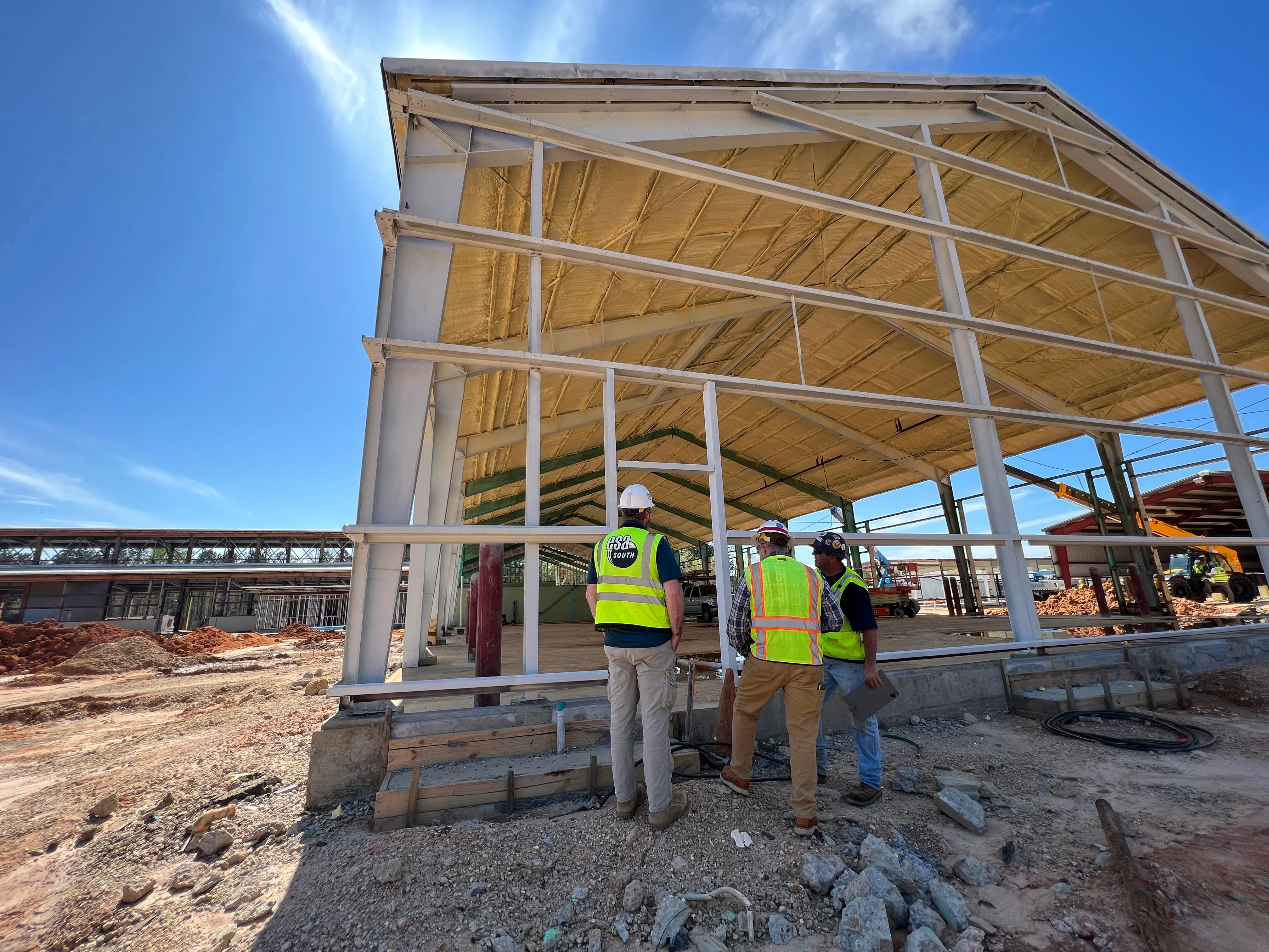 The ESA team at Camp Shelby outside one of the in-progress structures